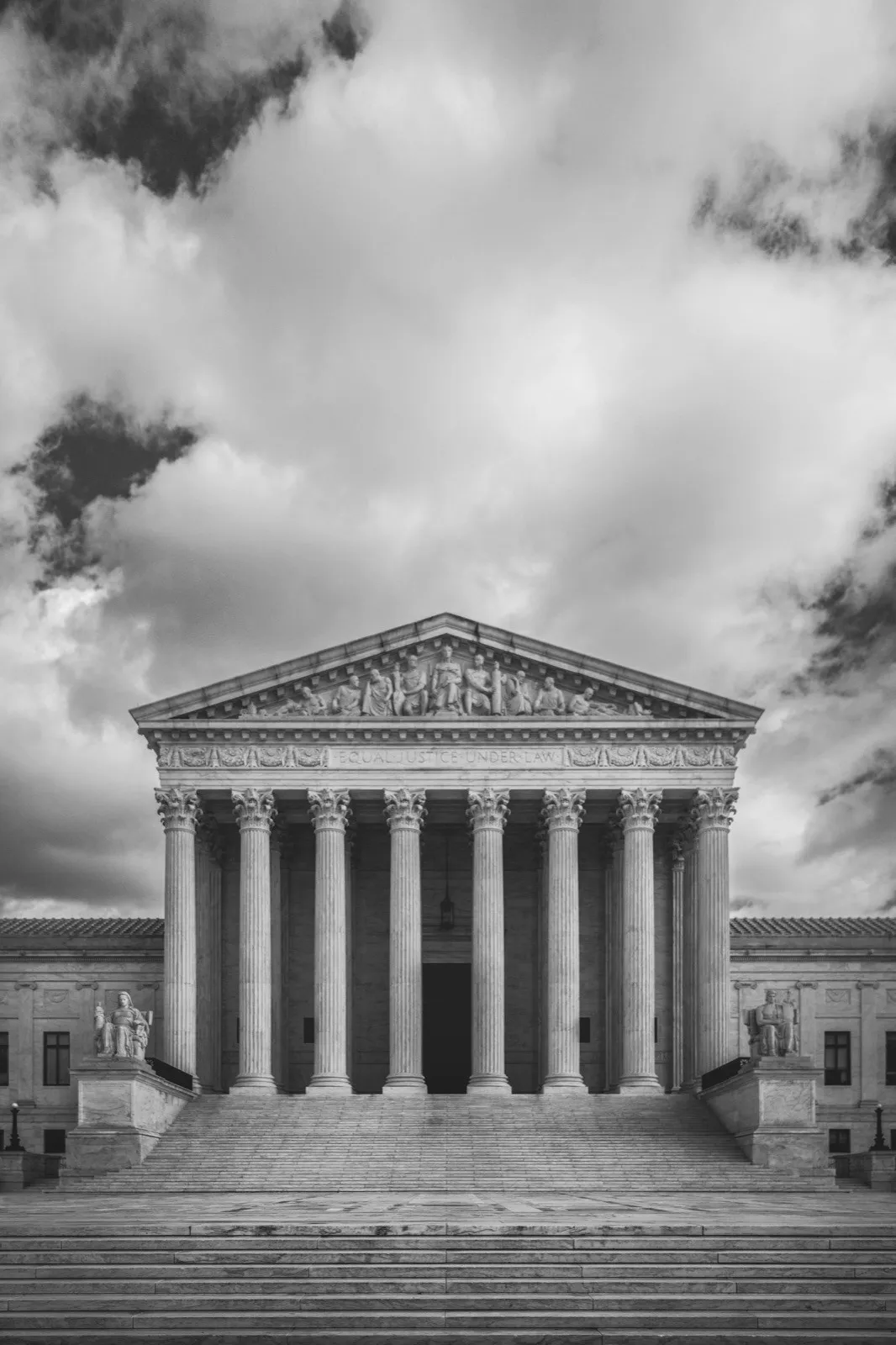 The front of the United States Supreme Court in black and white