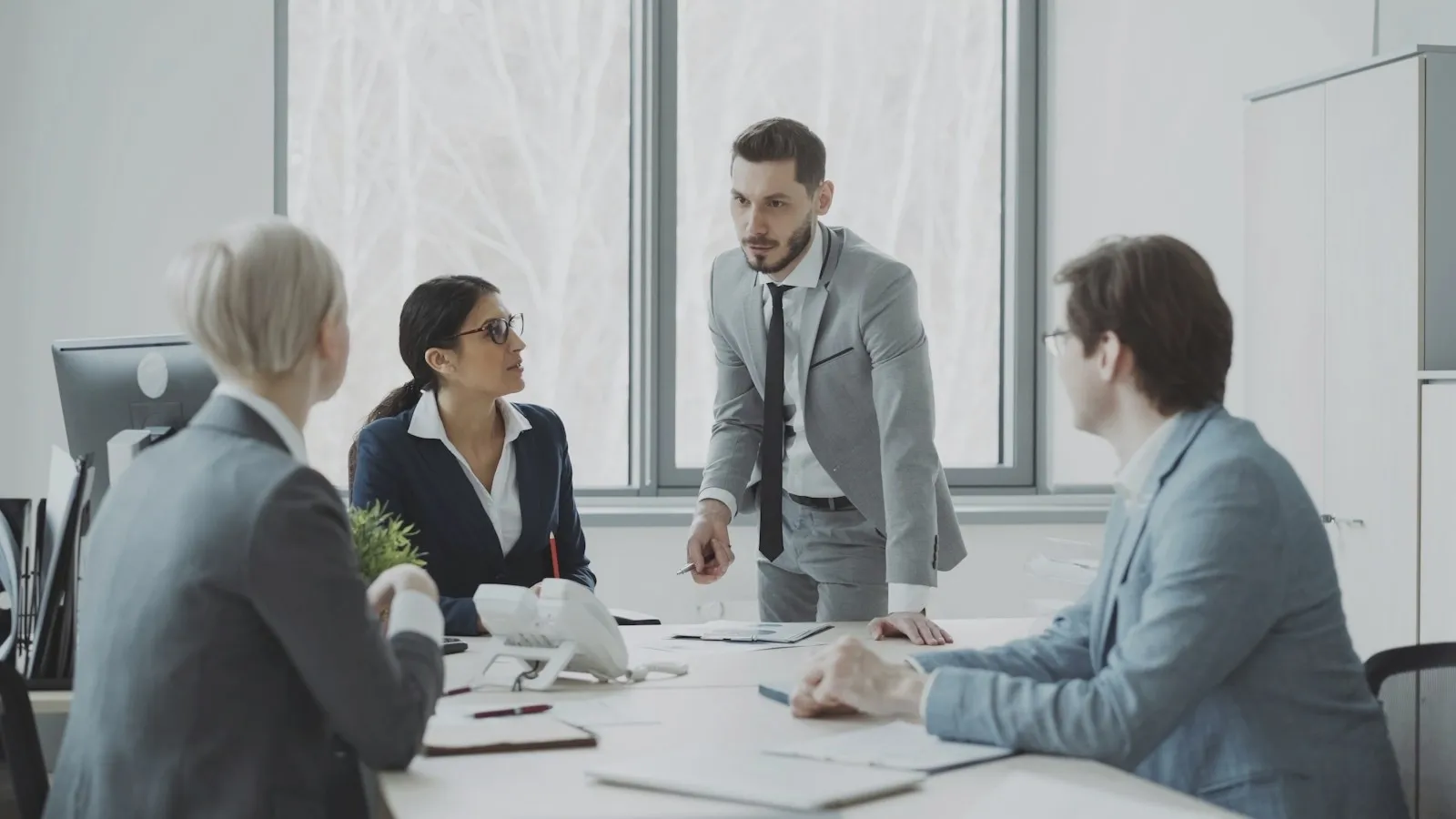 Colleagues in a meeting around a conference table